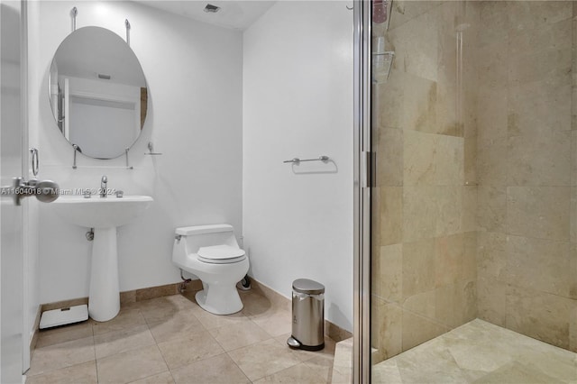 bathroom with an enclosed shower, toilet, and tile floors