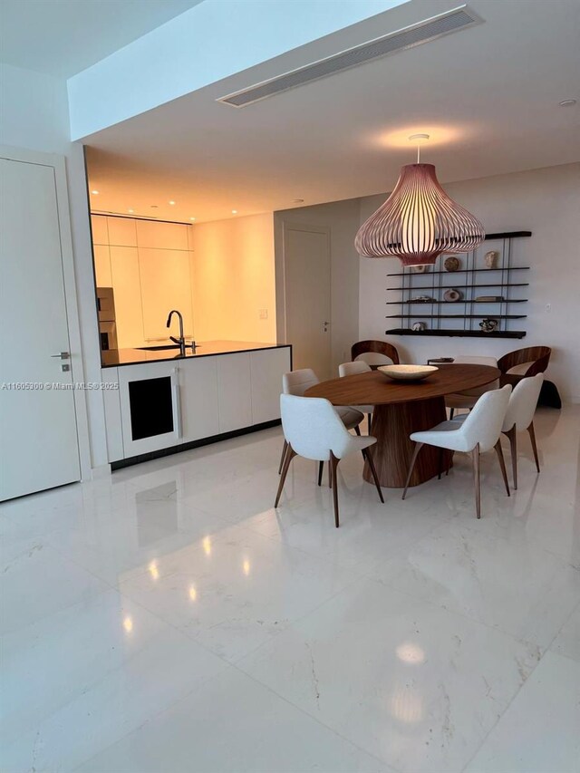 300 Biscayne Blvd Way Unit 5009, Miami, FL 33131 - dining space featuring light marble finish floors
