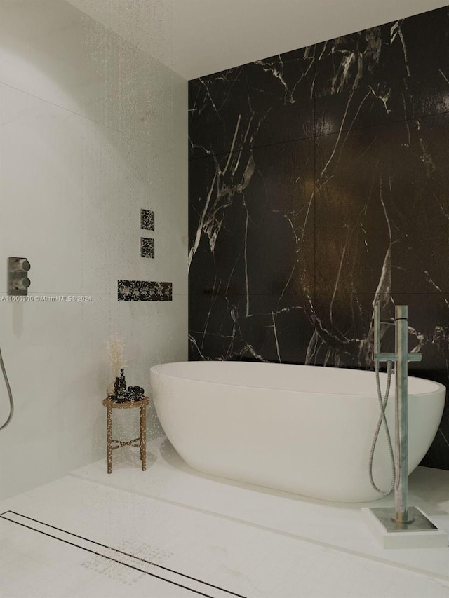 bathroom featuring tile walls and a tub to relax in