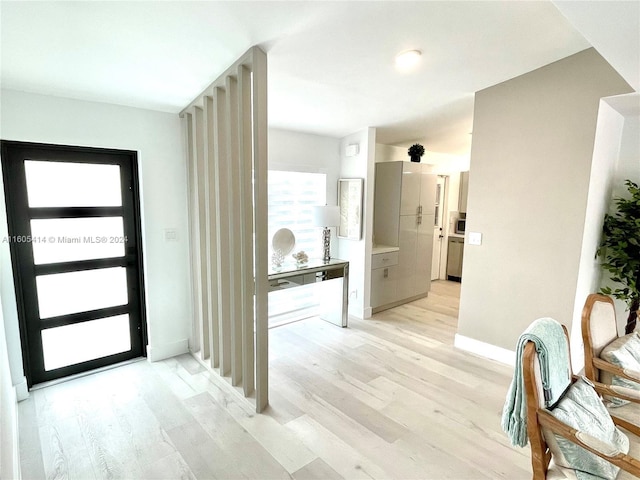 entryway with light hardwood / wood-style floors