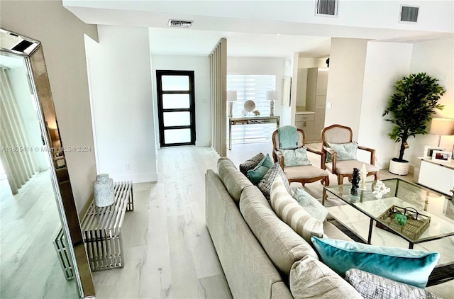 living room with light hardwood / wood-style floors