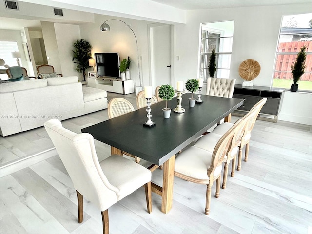 dining space featuring light hardwood / wood-style floors