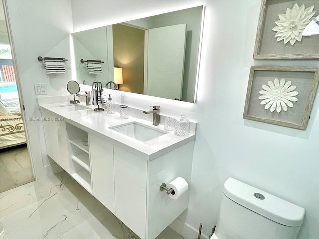 bathroom with vanity and toilet