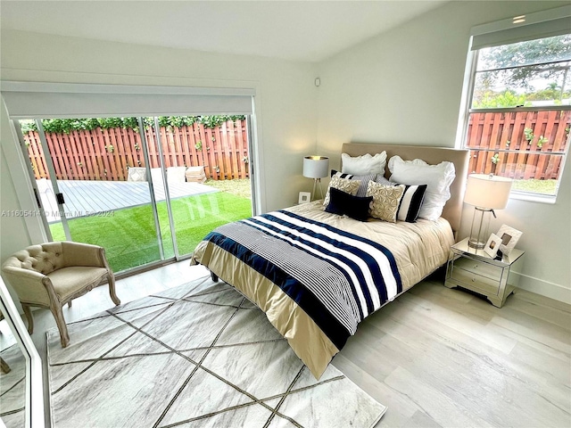 bedroom with hardwood / wood-style floors