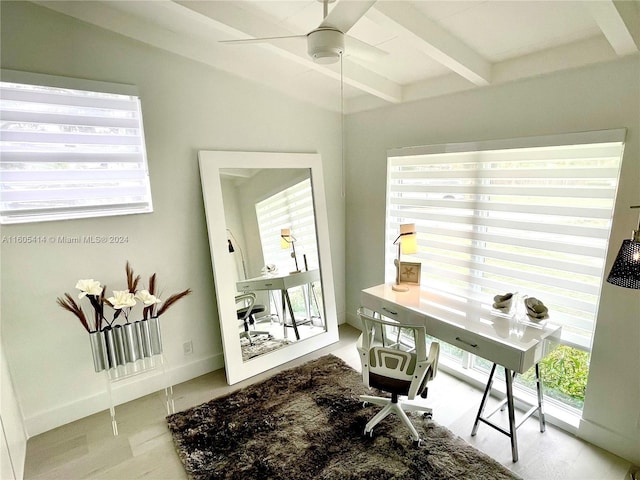 office featuring beamed ceiling, hardwood / wood-style flooring, ceiling fan, and a healthy amount of sunlight