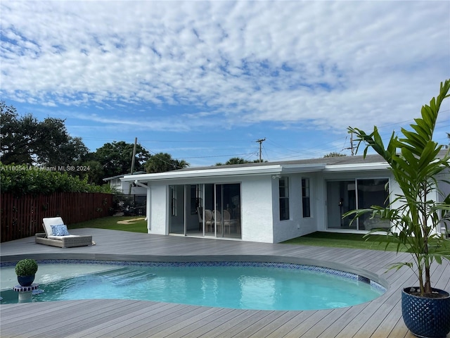 view of swimming pool featuring a wooden deck