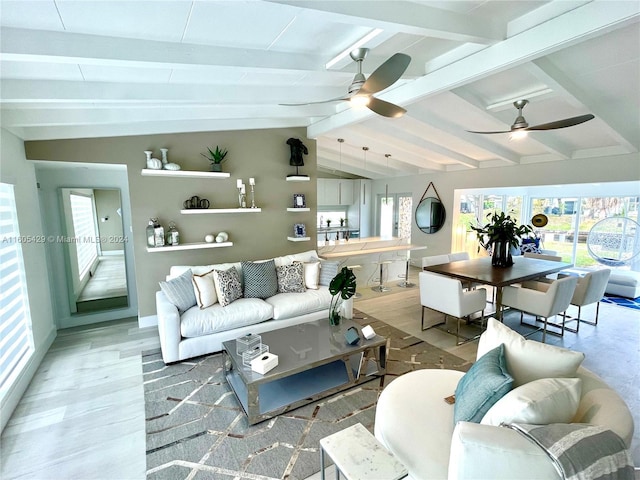 living room featuring vaulted ceiling with beams, wood-type flooring, and ceiling fan