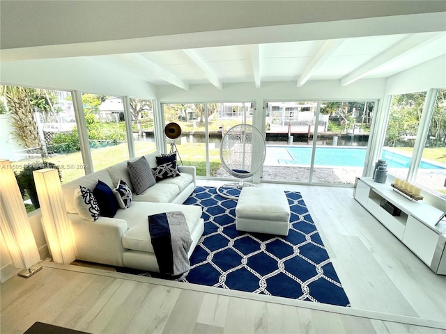 living room with beam ceiling and wood-type flooring