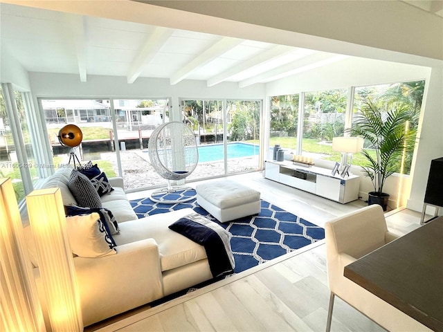 interior space with vaulted ceiling with beams