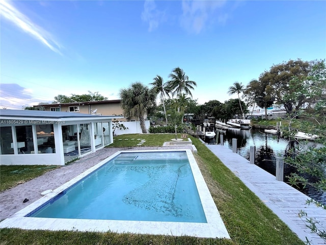 view of pool with a water view