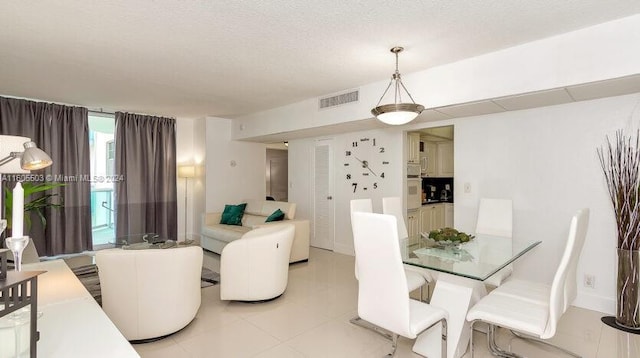 dining space featuring a textured ceiling