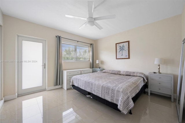 tiled bedroom with ceiling fan