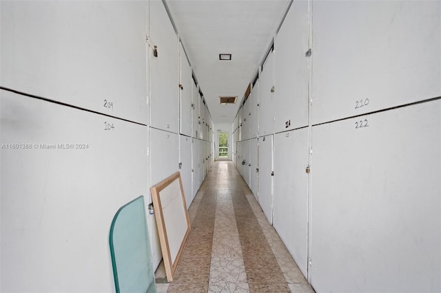 hallway featuring light tile patterned floors