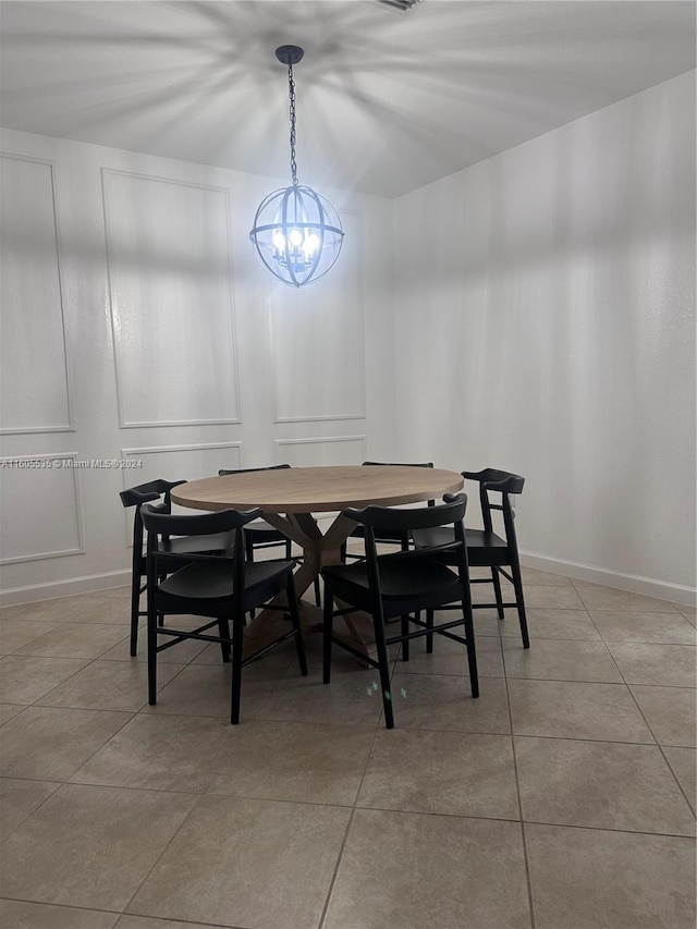 dining room featuring light tile patterned floors and a notable chandelier