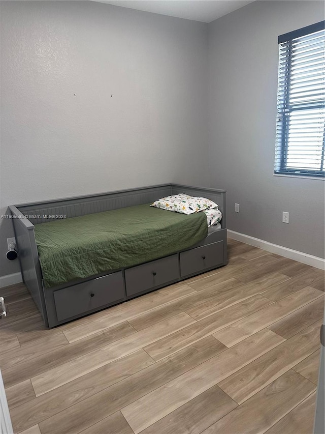 unfurnished bedroom featuring light hardwood / wood-style floors