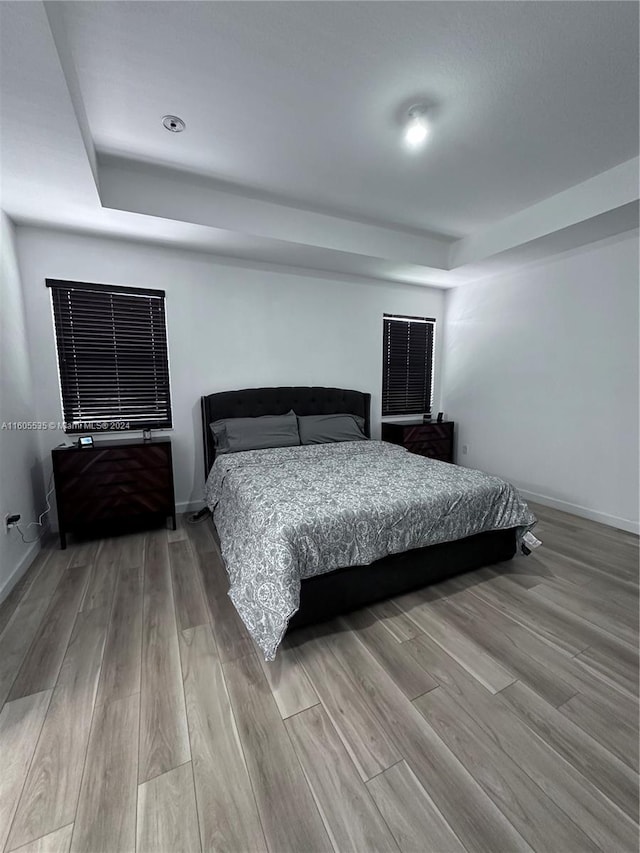 bedroom with light hardwood / wood-style floors