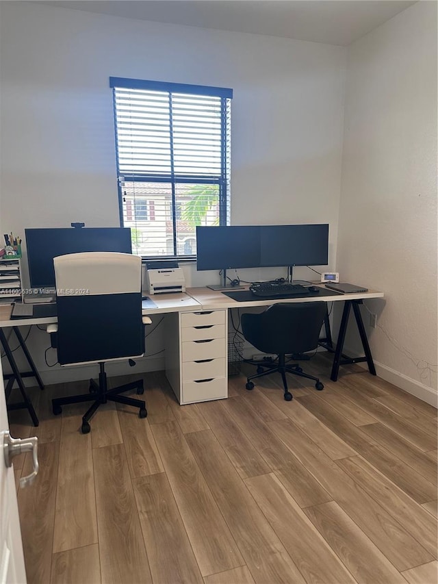 office area with light hardwood / wood-style flooring