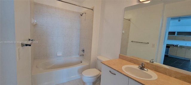 full bathroom with vanity, toilet, and tiled shower / bath combo