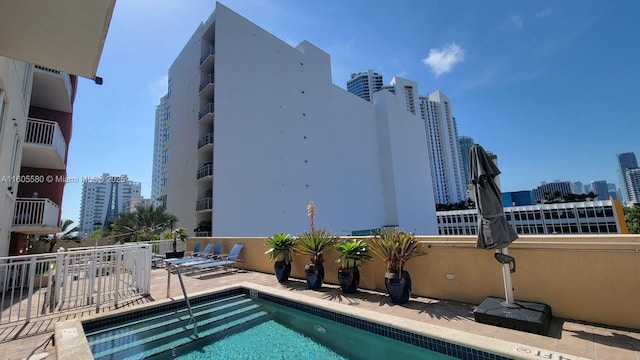 view of swimming pool featuring a patio