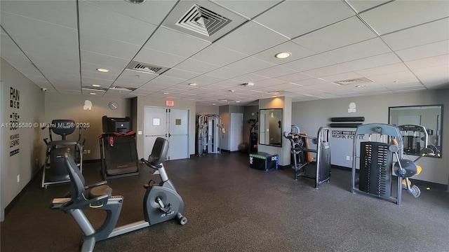 gym featuring a paneled ceiling