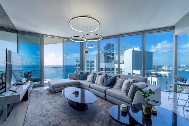 living room with floor to ceiling windows and a water view