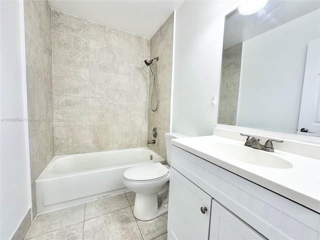 full bathroom featuring tile patterned flooring, vanity, toilet, and tiled shower / bath