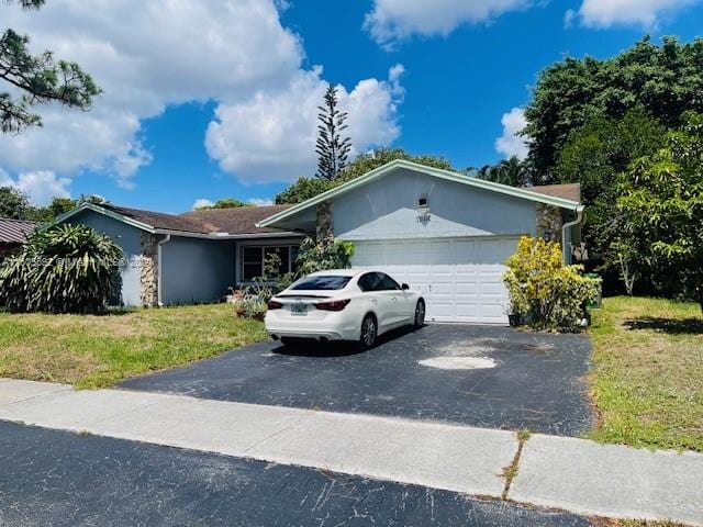 single story home with a garage