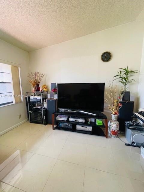 living room with tile flooring and a textured ceiling