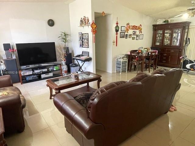 tiled living room with ceiling fan