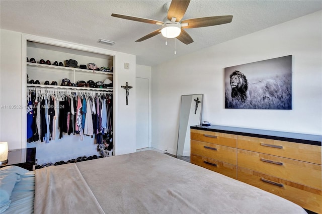 unfurnished bedroom featuring a closet, ceiling fan, and a textured ceiling