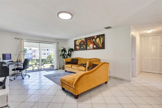 office area featuring plenty of natural light and light tile patterned floors