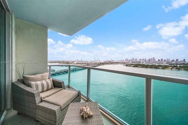 balcony featuring a water view