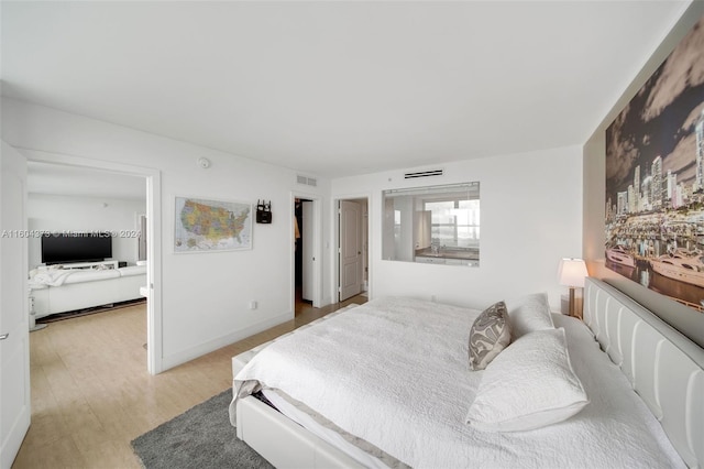 bedroom featuring light wood-type flooring