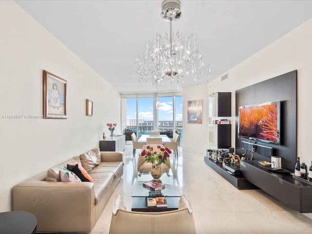 living room featuring a notable chandelier, expansive windows, and light tile floors