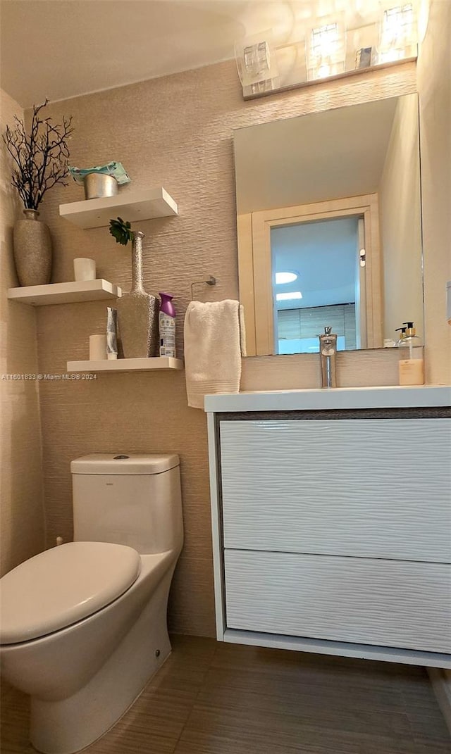 bathroom featuring vanity and toilet