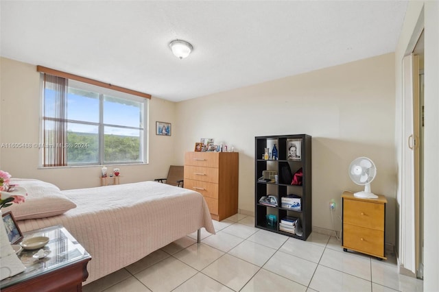 bedroom with light tile flooring