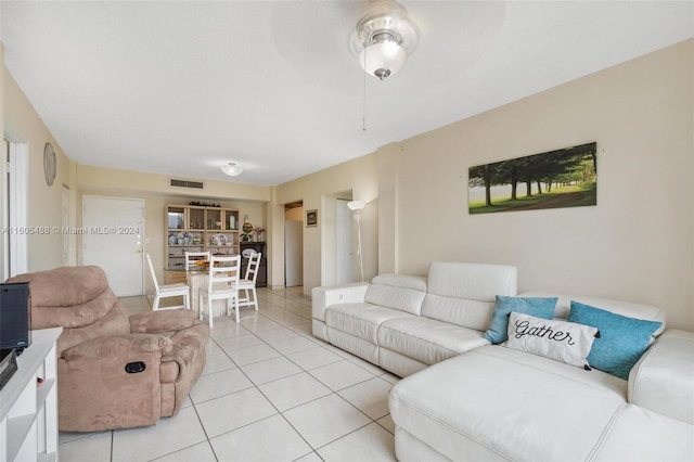 living room featuring light tile flooring