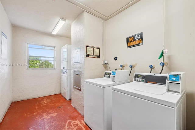 washroom with washing machine and clothes dryer and washer hookup