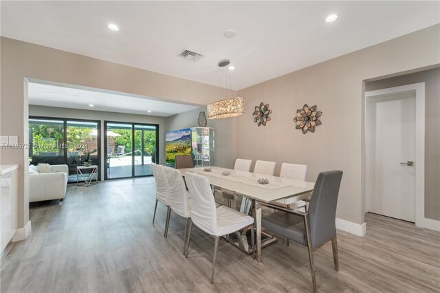 dining space featuring light hardwood / wood-style floors