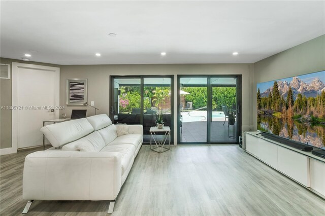 living room with light hardwood / wood-style flooring