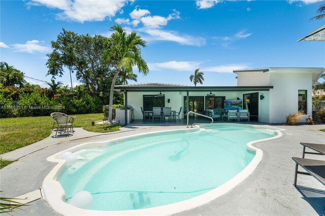 view of pool featuring a patio area