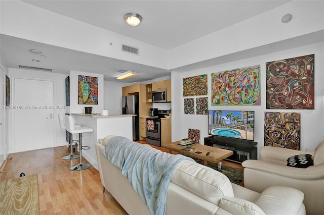 living room with light hardwood / wood-style floors