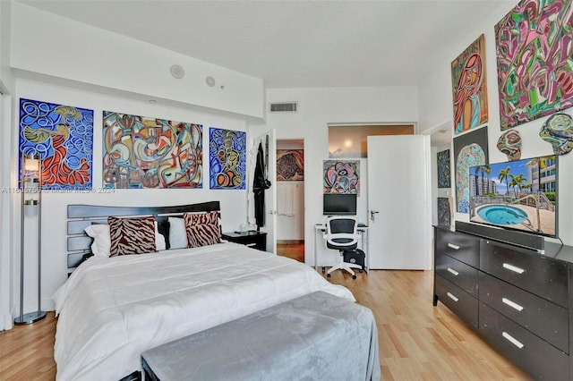 bedroom with light wood-type flooring