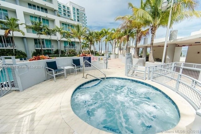 view of pool featuring a hot tub