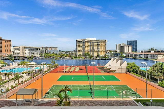 view of sport court with a water view