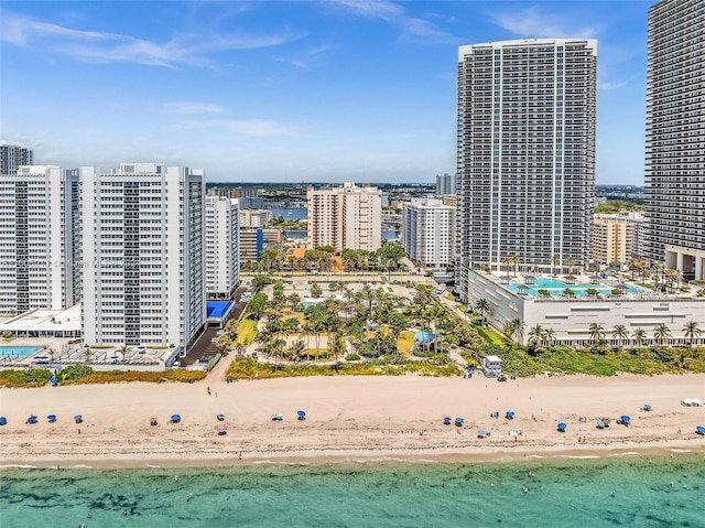 bird's eye view featuring a water view and a view of the beach