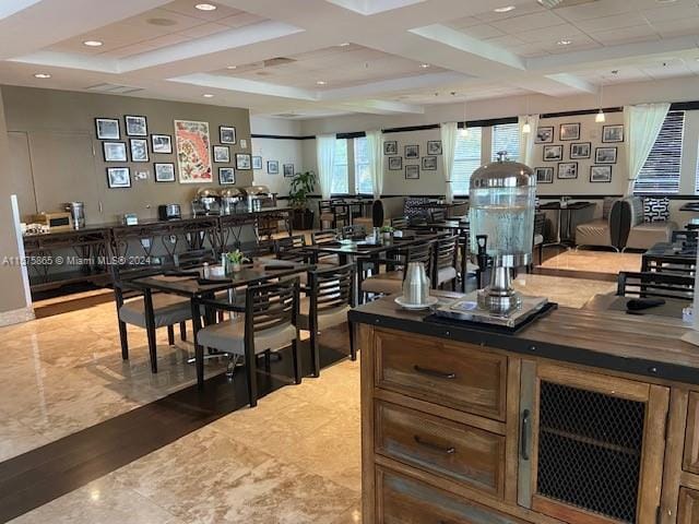 dining space with beamed ceiling and coffered ceiling