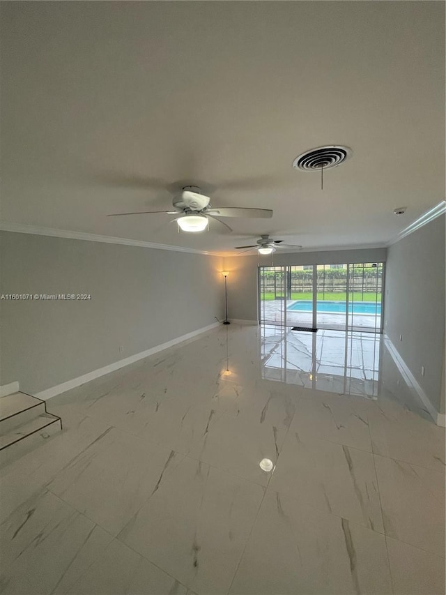 unfurnished room featuring ceiling fan and crown molding