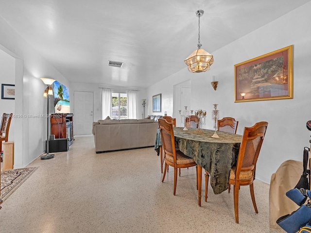 dining area with a notable chandelier