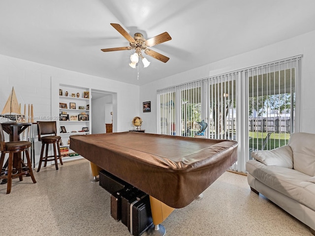 rec room featuring pool table, ceiling fan, and built in features